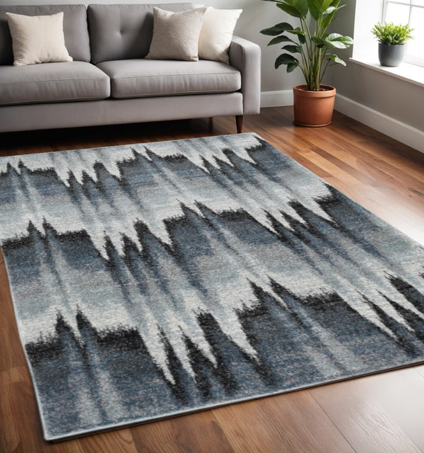 HomeRoots 5' Contemporary Abstract Area Rug in Ivory, Blue, and Gray - Durable, Stylish, and Low-Maintenance Design 5' X 8' 374852