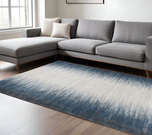 HomeRoots 8' Ivory and Blue Abstract Area Rug - Modern Elegance for Living Spaces, Stain-Resistant Comfort 8' X 11' 374856