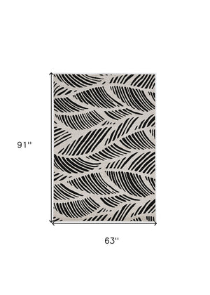HomeRoots 5' Black and White Abstract Area Rug - Stylish Indoor/Outdoor Decorative Accent for High-Traffic Spaces 5' x 8' 375010