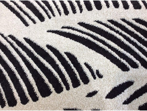 HomeRoots 5' Black and White Abstract Area Rug - Stylish Indoor/Outdoor Decorative Accent for High-Traffic Spaces 8' x 11' 375012