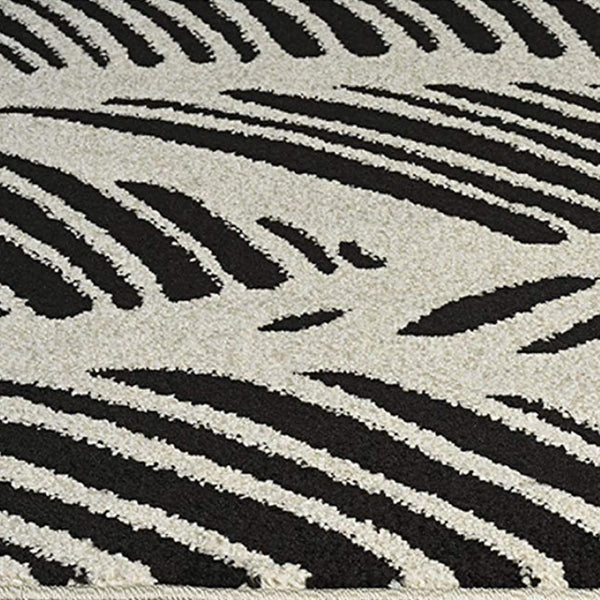 HomeRoots 5' Black and White Abstract Area Rug - Stylish Indoor/Outdoor Decorative Accent for High-Traffic Spaces 8' x 11' 375012