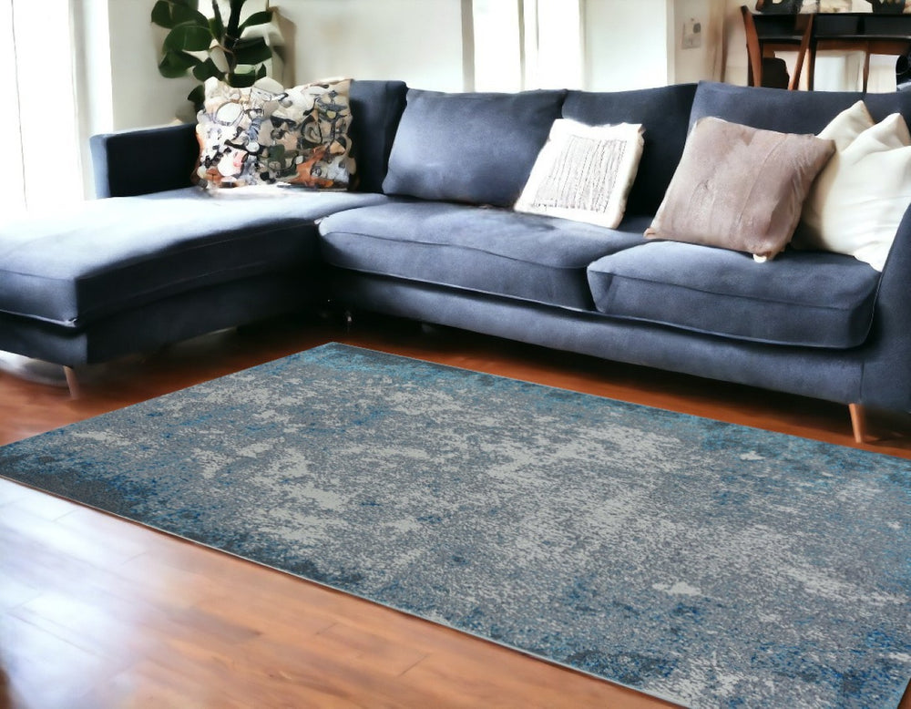 HomeRoots 10' Elegant Silver-Blue Abstract Smudge Area Rug - Modern Design for Living & Dining Spaces 10' X 13' 375046