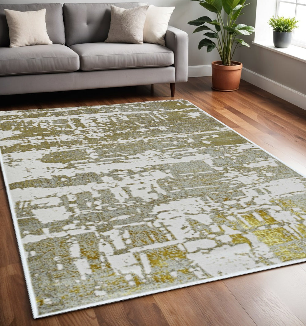 HomeRoots 5' Elegant Ivory and Gold Abstract Area Rug - Durable, Stain-Resistant Design for Modern Homes 5' X 8' 375048