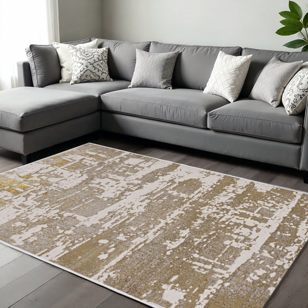 HomeRoots 10' Elegant Ivory, Taupe, and Gold Abstract Area Rug – Modern Design for Stylish Living Spaces 10' X 13' 375051