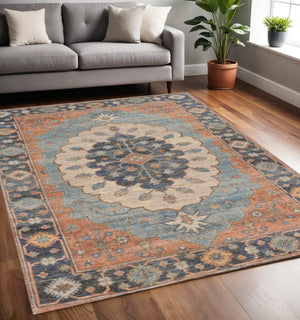 HomeRoots 5' Handcrafted Jute Medallion Area Rug in Blue, Orange, and Black - Rustic Charm for Any Space 5' X 7' 375079