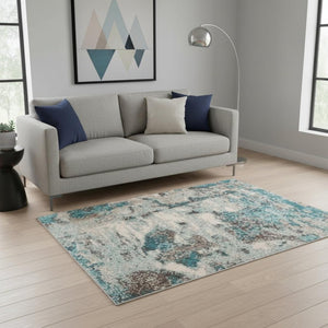 HomeRoots 5' Ivory and Teal Abstract Area Rug - Stylish, Durable, Stain-Resistant Design for Modern Spaces 5' X 8' 375595