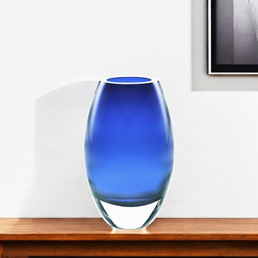 HomeRoots 9" Blue Oval Lead-Free Crystal Table Vase - Handcrafted Elegance for Floral Displays & Décor Accents 375821