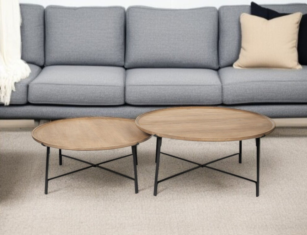 HomeRoots Set of Two Rustic Round Nested Coffee Tables with Solid Wood Tops & Industrial Iron Base Design 376282