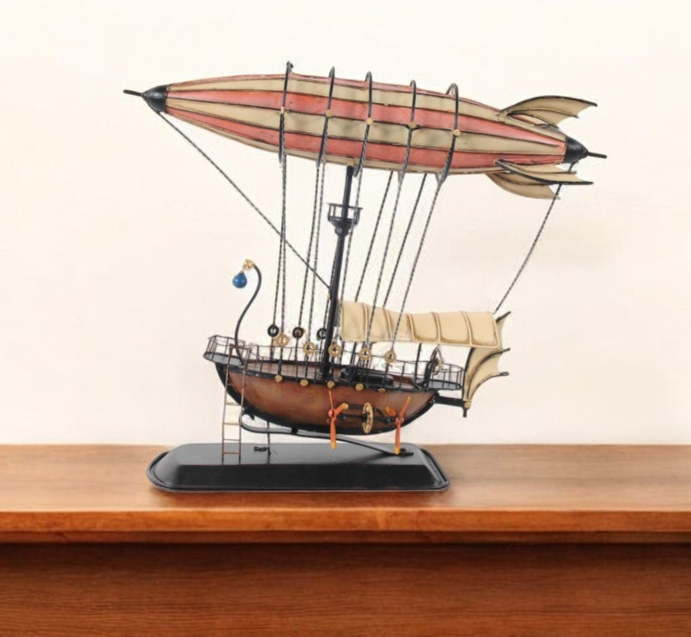 Homeroots 12" Pink And Orange Metal Hand Painted Model Airplane Tabletop Sculpture  Metal 376333