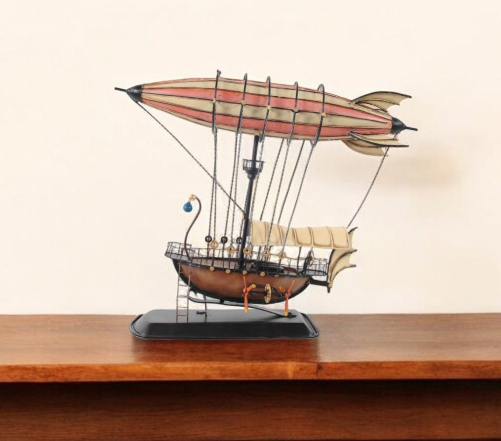 Homeroots 12" Pink And Orange Metal Hand Painted Model Airplane Tabletop Sculpture  Metal 376333