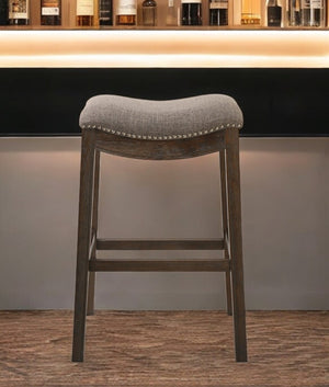 HomeRoots 31" Taupe Upholstered Backless Bar Chair with Brown Solid Wood Base for Modern Farmhouse Style 380067