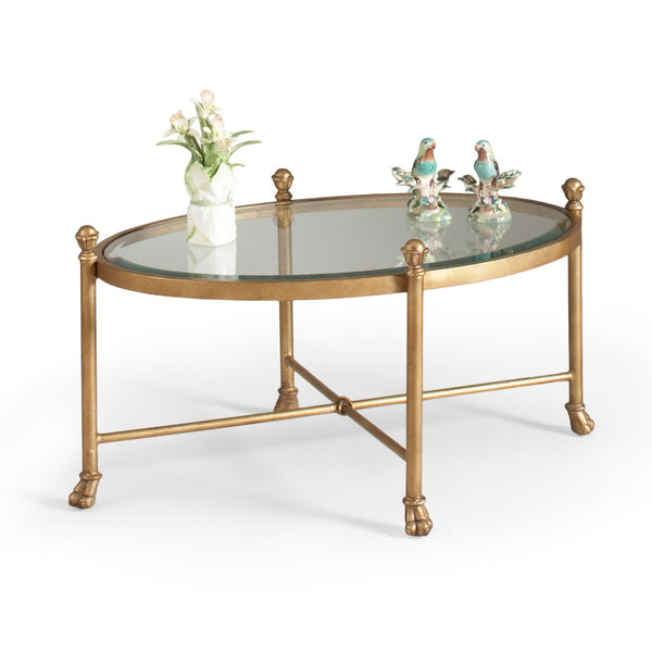 Chelsea House Gordon Oval Cocktail Table With Antique Gold Ornamental Base And Tempered Glass Top For Elegant Living Spaces 380087