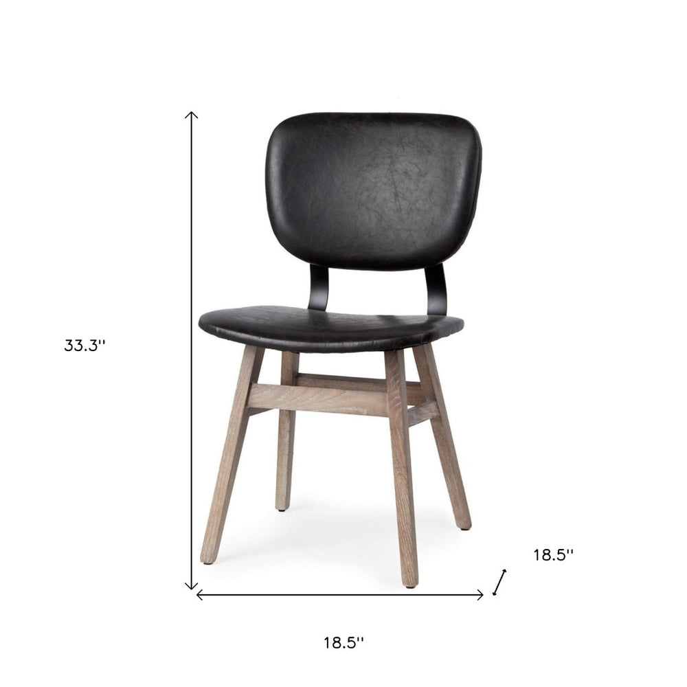 HomeRoots Set of Two Modern Black Faux Leather Armless Side Chairs with Brown Wood Legs for Dining & Accent Use 380402