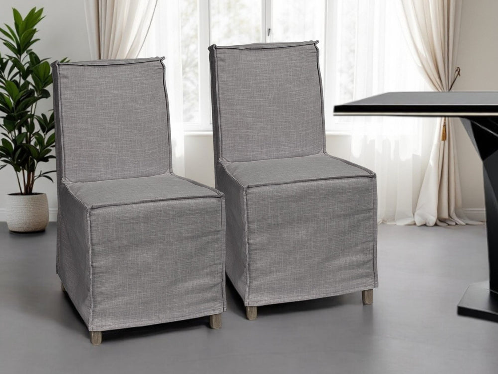 HomeRoots Set of Two Stylish Gray Slipcovered Parsons Chairs with Brown Wood Legs for Modern Spaces 380404