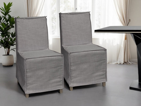 HomeRoots Set of Two Stylish Gray Slipcovered Parsons Chairs with Brown Wood Legs for Modern Spaces 380404