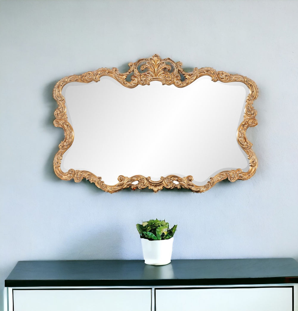 Homeroots 27" Gold Ornate Scroll Framed Accent Mirror  Polyurethane Foam 383714