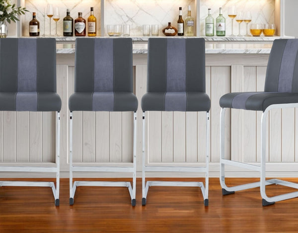 HomeRoots Set of Four Stylish 26" Gray Faux Leather & Silver Metal Bar Chairs for Modern Dining Spaces 383949