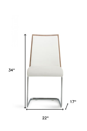 HomeRoots Set of Two Stylish White and Silver Faux Leather Dining Chairs for Modern Spaces & Comfort 384362
