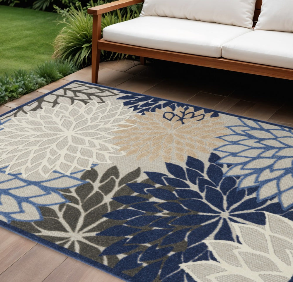HomeRoots 5' Elegant Ivory and Blue Round Indoor-Outdoor Area Rug with Timeless Floral Design and Durability 7?x10? 384823