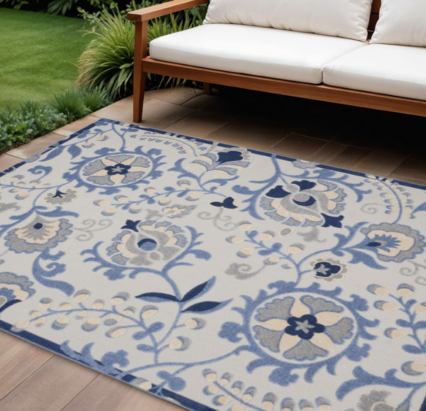 HomeRoots 7' Elevate Your Space with a Blue and Gray Floral Indoor-Outdoor Rug for Stylish Comfort & Durability 7'x10' Area Rug 384841
