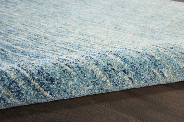 HomeRoots 5' Blue and Ivory Abstract Area Rug - Modern Design, Durable, Soft Pile for Any Room Decor Style 5' X 7' Rectangle 385284