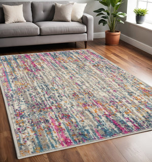 HomeRoots 5' Abstract Area Rug in Ivory and Blue - Modern Elegance for Living Rooms, Bedrooms & Offices 5' x 7' 385352