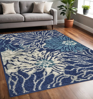 HomeRoots 5' Blue and Ivory Floral Area Rug - Timeless Elegance for Living Rooms & High-Traffic Spaces 5? x 7? 385479