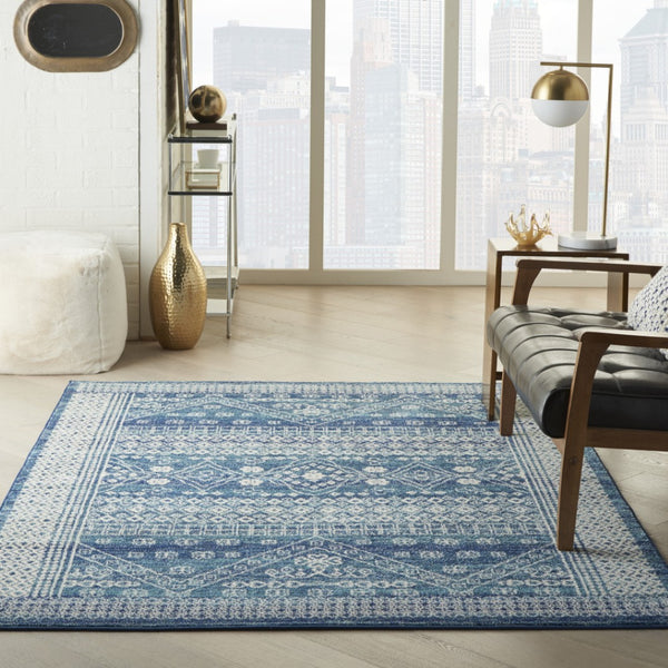 HomeRoots 5' Navy Blue and Ivory Tribal Area Rug - Stylish, Durable Floor Cover for Modern Living Spaces 5' x 7' 385605