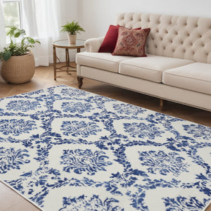 Homeroots 5' X 7' Blue And Ivory Floral Dhurrie Area Rug Ivory Navy Polypropylene 385823