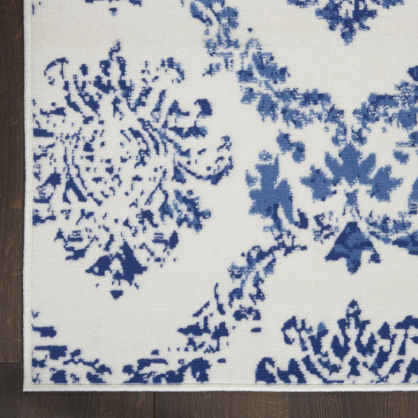HomeRoots 6' Ivory and Blue Damask Distressed Area Rug - Timeless Elegance for Living Rooms and More 6' X 9' 385824