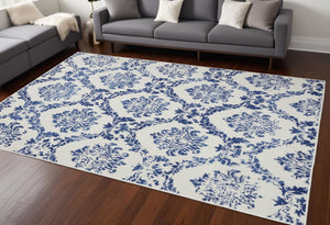 HomeRoots 6' Ivory and Blue Damask Distressed Area Rug - Timeless Elegance for Living Rooms and More 6' X 9' 385824