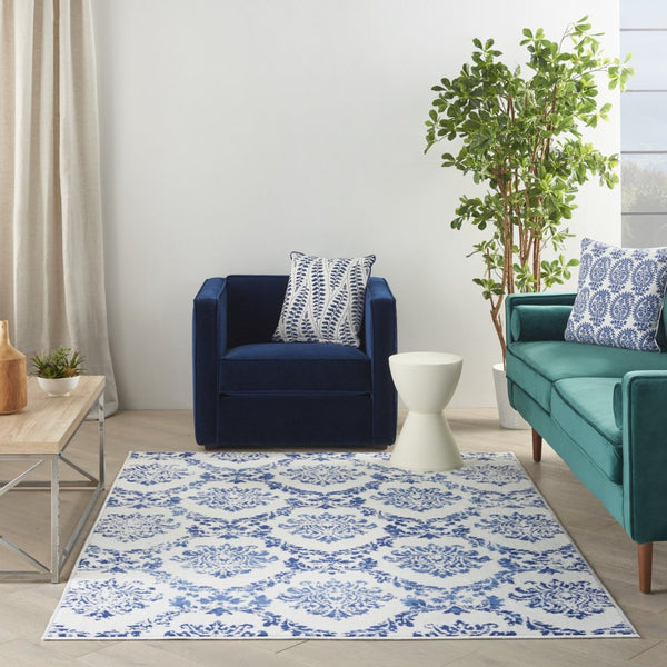 HomeRoots 6' Ivory and Blue Damask Distressed Area Rug - Timeless Elegance for Living Rooms and More 6' X 9' 385824