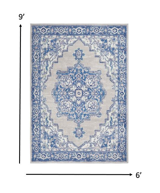 Homeroots 6' X 9' Blue Gray Floral Dhurrie Area Rug Grey Blue Polypropylene 385834