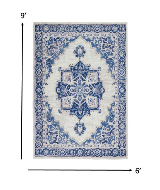 Homeroots 6' X 9' Blue And Ivory Floral Dhurrie Area Rug Ivory Blue Polypropylene 385837