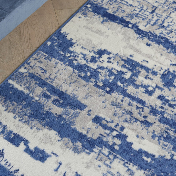 HomeRoots 6' Ivory and Blue Ombre Distressed Area Rug - Contemporary Design for Warmth and Style in Any Room 6' X 9' 385852