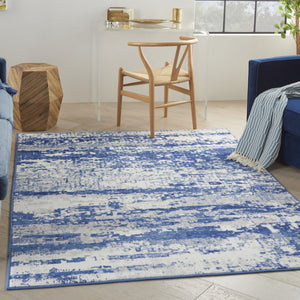 HomeRoots 6' Ivory and Blue Ombre Distressed Area Rug - Contemporary Design for Warmth and Style in Any Room 6' X 9' 385852