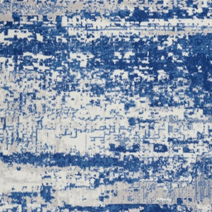 HomeRoots 6' Ivory and Blue Ombre Distressed Area Rug - Contemporary Design for Warmth and Style in Any Room 6' X 9' 385852