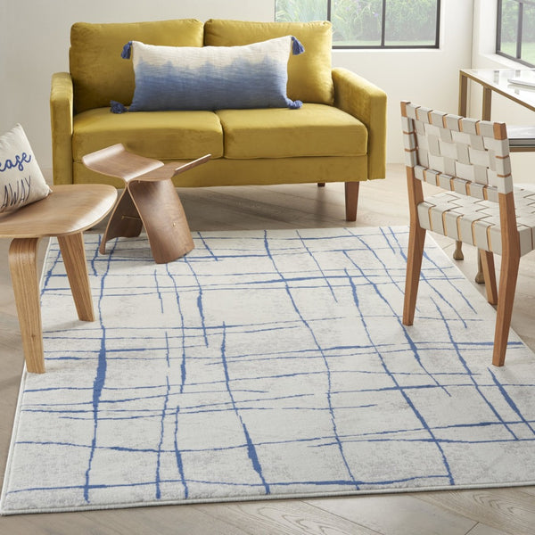 HomeRoots 6' Modern Ivory and Blue Geometric Distressed Area Rug for Stylish Living Spaces and Warmth 6?x9? 385864