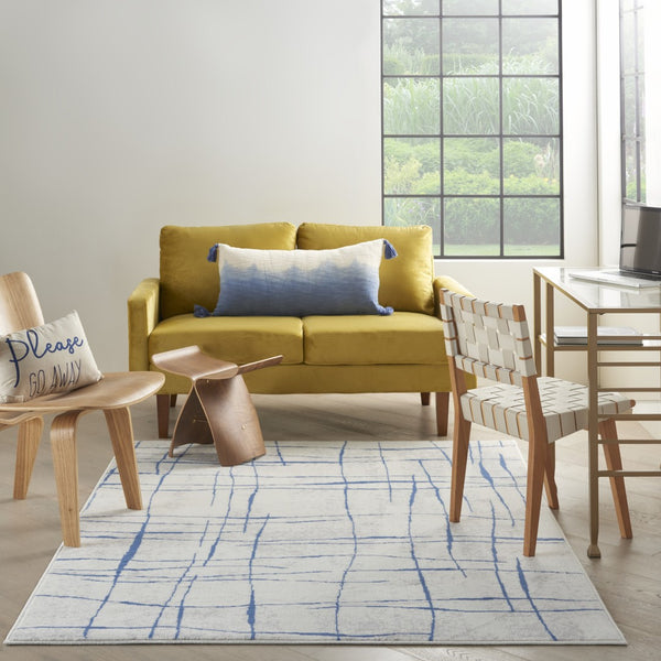 HomeRoots 6' Modern Ivory and Blue Geometric Distressed Area Rug for Stylish Living Spaces and Warmth 6?x9? 385864
