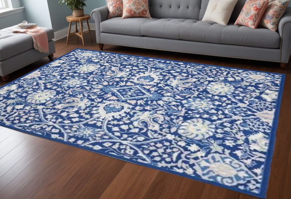 HomeRoots 6' Blue and Ivory Floral Area Rug - Timeless Elegance for Living Rooms, Bedrooms, and Dining Areas 6' X 9' 385867