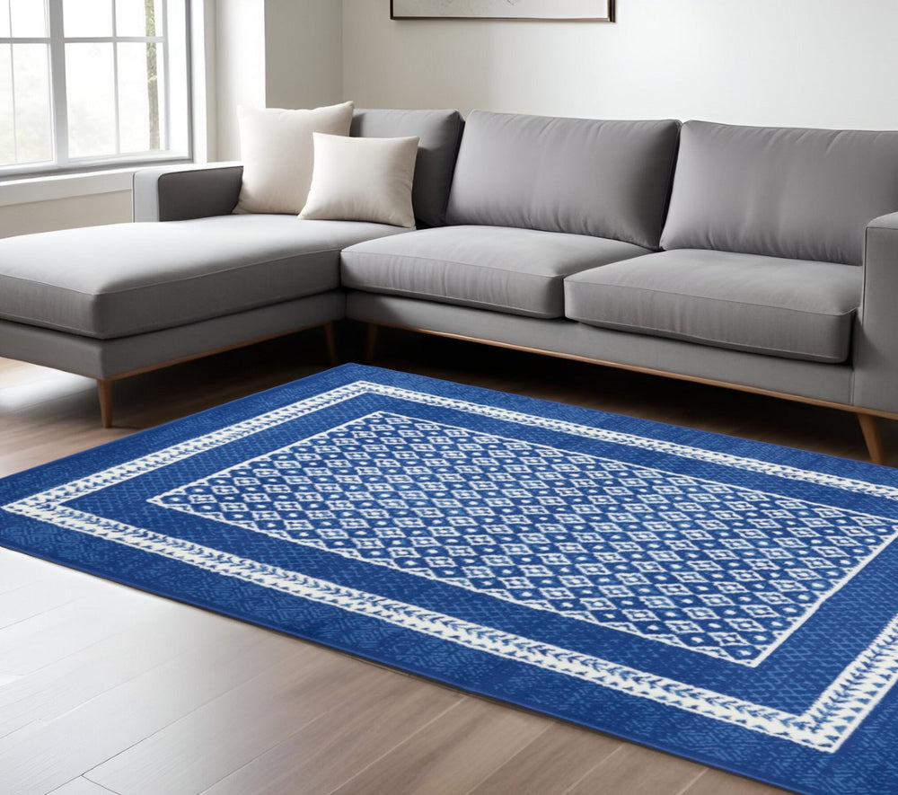 HomeRoots 6' Contemporary Ivory and Blue Geometric Area Rug - Stylish, Durable, and Perfect for Any Room 6?x9? 385885