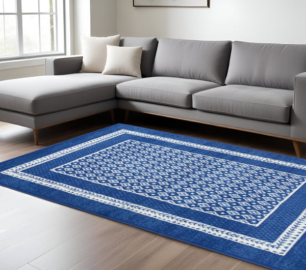 HomeRoots 6' Contemporary Ivory and Blue Geometric Area Rug - Stylish, Durable, and Perfect for Any Room 6?x9? 385885