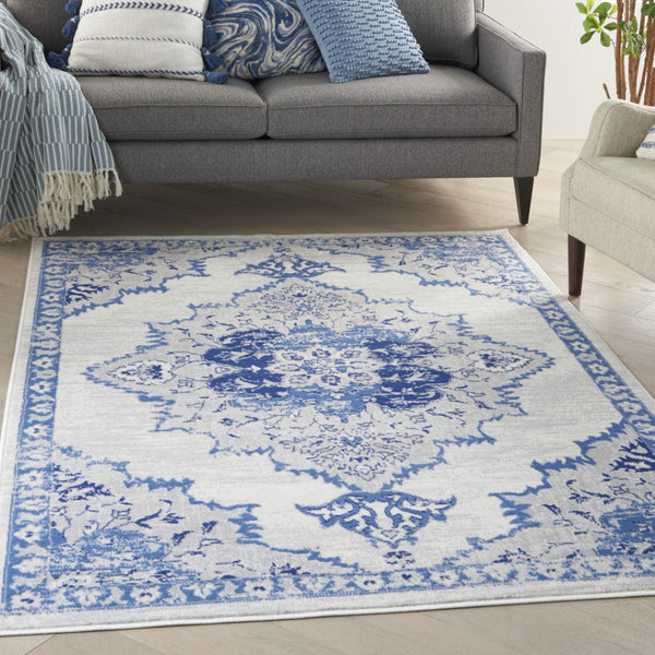 HomeRoots 6' Elegant Ivory and Blue Floral Area Rug - Timeless Design for Living Rooms and Bedrooms 6' X 9' 385888