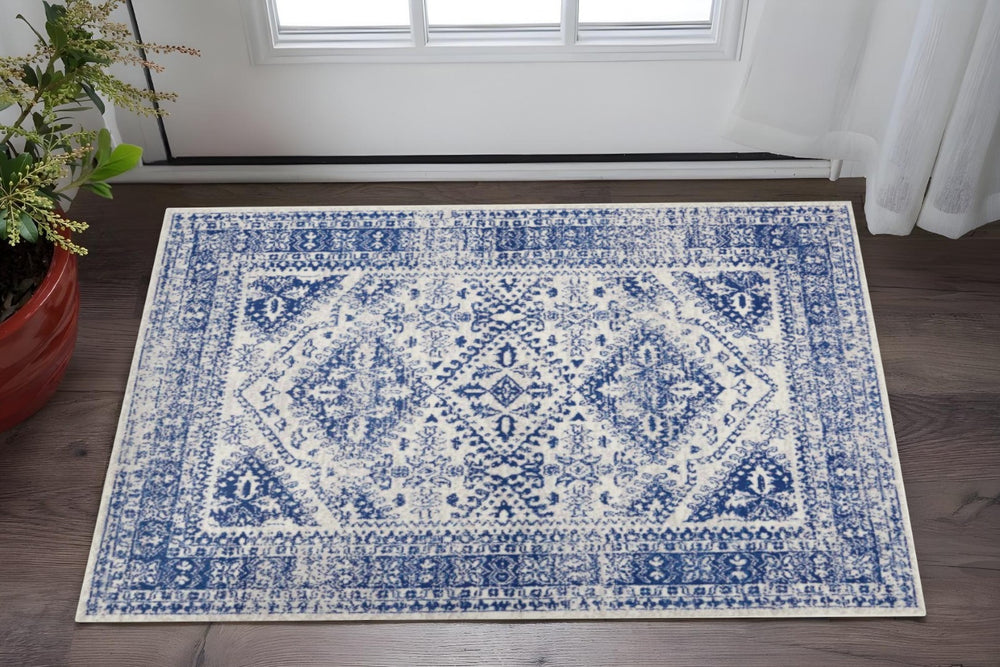 HomeRoots 6' Ivory and Blue Geometric Distressed Area Rug – Modern Design for Timeless Appeal in Any Room 6' X 9' 385891