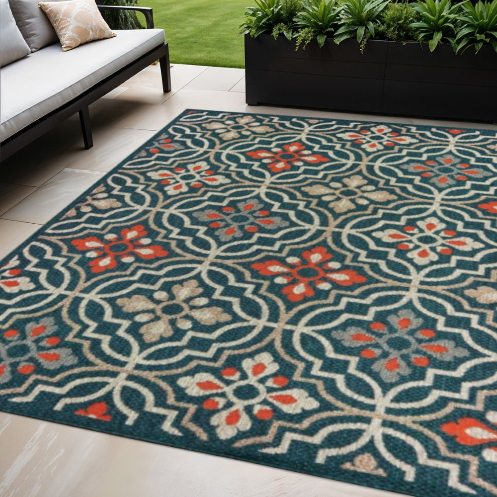 HomeRoots 5' Moroccan Indoor/Outdoor Area Rug - Vibrant Blue & Orange Quatrefoil Design for Any Space Teal/ Orange 5'3" x 7'3" 388361