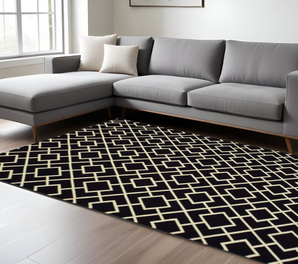HomeRoots 10' Black and Ivory Diamond Area Rug - Modern Style, Durable, Stain-Resistant for High-Traffic Areas 9' X 12' 388416