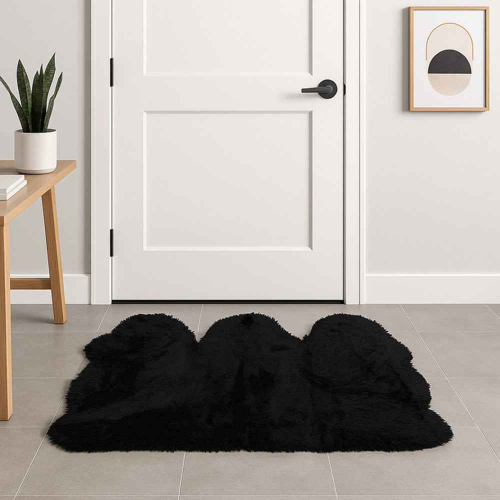 HomeRoots 3' X 5' Black Natural Sheepskin Area Rug - Luxurious, Hypoallergenic, and Versatile for Any Space 388528