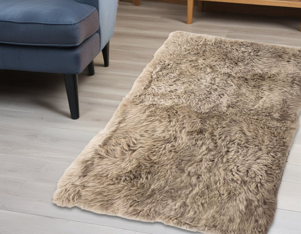 HomeRoots 3' X 5' Taupe Genuine Sheepskin Area Rug - Luxurious New Zealand Softness for Cozy Home Decor 388538