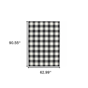 HomeRoots 5' Timeless Indoor Outdoor Area Rug - Durable, Stylish Design Perfect for Patios, Kitchens, and More Black/ Ivory 5'3" x 7'6" 389519