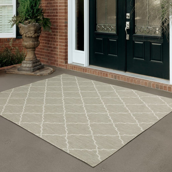 HomeRoots 7' Gray and Ivory Indoor Outdoor Area Rug - Durable, Stylish, Low-Profile Design for Any Space 6'7" x 9'2" 389550